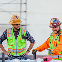 Construction workers looking over a plan