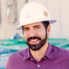 Man in hard hat smiling